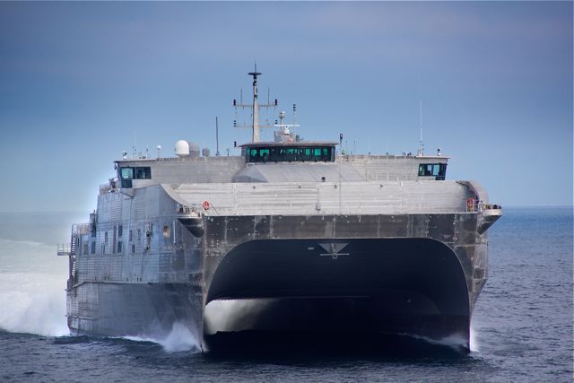The high-speed catamaran transport ship USS Spearhead, the first ship in the JHSV class that will include the USS Millinocket, is shown here undergoing sea trials on April 19 by shipbuilder Austal in the Gulf of Mexico. The Millinocket, which has an identical design, is under construction and scheduled for christening in January.