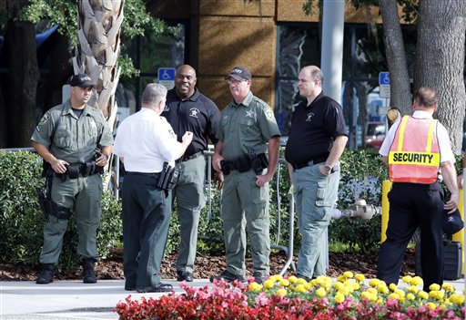 Hillsborough, Fla., sheriff deputies patrol outside the gate of JPMorgan Chase annual stockholders meeting held today in Tampa.