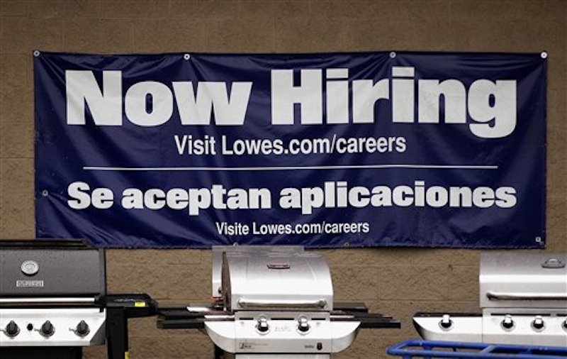 A Lowes store advertises job openings near its gas grills outside the home improvement store in Pembroke, Mass., Tuesday, May 8, 2012. The Labor Department said Tuesday that U.S. companies in March posted the highest number of job openings in nearly four years, a sign that hiring could strengthen in the coming months after slowing this spring. (AP Photo/Stephan Savoia)