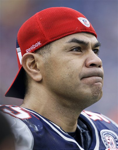 In this Dec. 27, 2009 photo, New England Patriots linebacker Junior Seau (55) stands on the side lines against the Jacksonville Jaguars during an NFL football game in Foxborough, Mass. Police say Seau, a former NFL star, was found dead at his home in Oceanside, Calif., Wednesday, May 2, 2012, after responding to a shooting there. He was 43. (AP Photo/Charles Krupa, File)