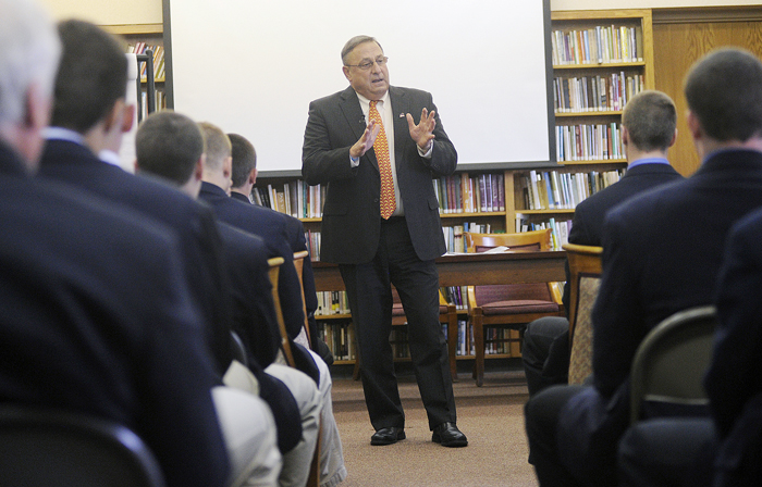 Gov. Paul LePage speaks with Cheverus High School students about domestic violence today in a library in the high school's Loyola Hall.