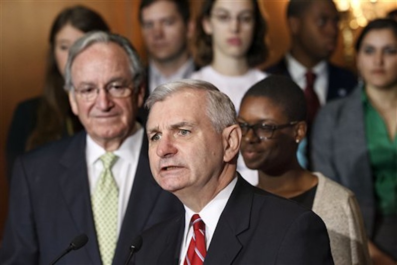Sen. Jack Reed, D-R.I., center, accompanied by Sen. Tom Harkin, D-Iowa, left, and students, speaks at a news conference on Capitol Hill in Washington today, as the Senate moves toward a showdown on a Democratic proposal to keep federally subsidized loan interest rates from doubling for millions of college students. Clarise McCants of Philadelphia, right, a Howard University political science major, added her own appeal to the senators. (AP Photo/J. Scott Applewhite)