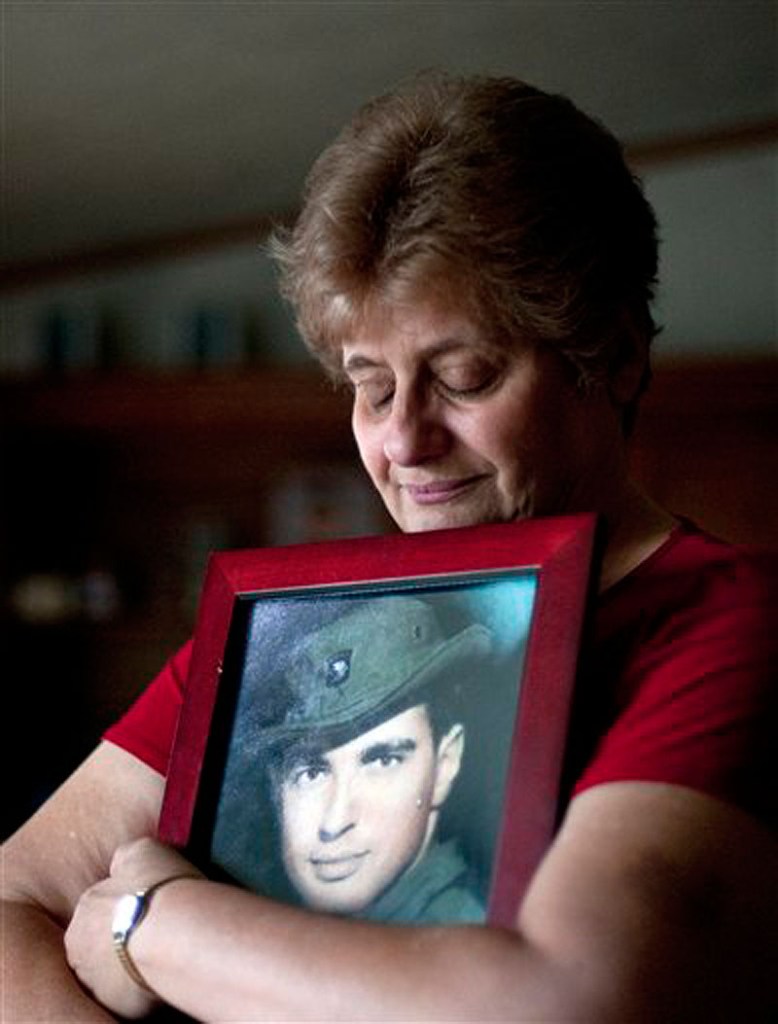 In a May 10, 2012 file photo Rose Mary Sabo-Brown holds a photo of her husband Army Specialist Leslie H. Sabo, Jr., in her home in New Castle, Pa. Sabo was killed in 1970 in Cambodia during the Vietnam War and is to posthumously receive the Medal of Honor in a ceremony at the White House Wednesday May 16, 2010. (AP Photo/Andrew Russell, Tribune-Review, file)