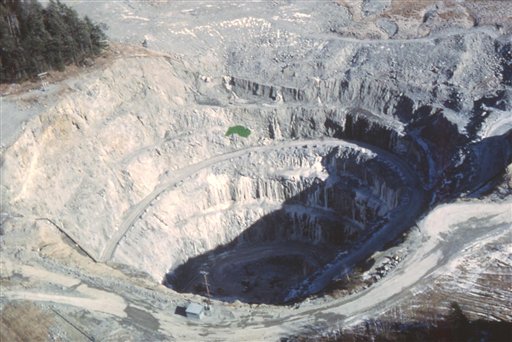 This 1970s-era photo provided by the Maine Geological Survey shows the Callahan Mining Corp. open pit in Brooksville while it was still active. Chemicals were used to extract the metals from the mine. The polluted Down East mine later became a federal Superfund cleanup site. (AP Photo/Maine Geological Survey)
