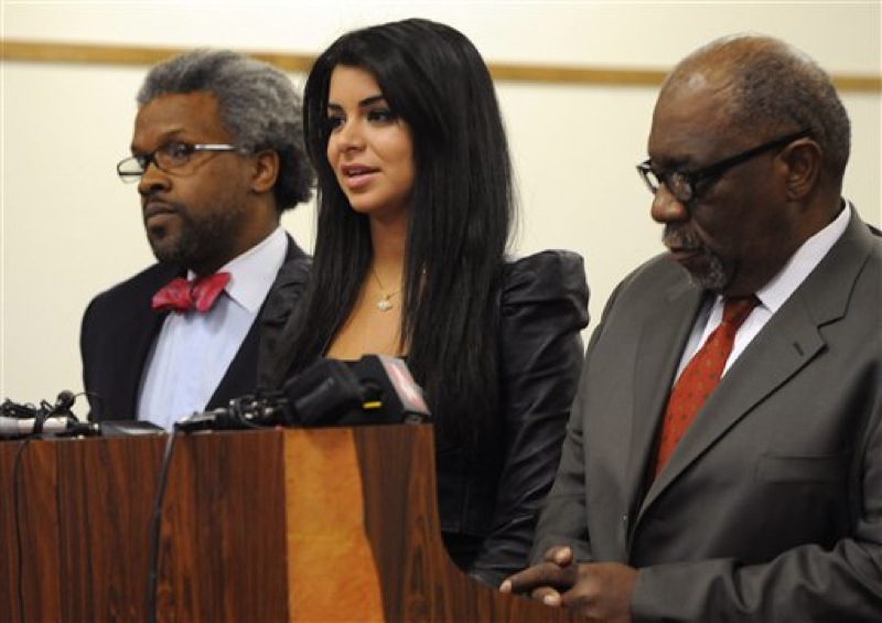 In this April, 11, 2012, file photo former Miss USA Rima Fakih, center, stands before the court with city attorney Todd Russell Perkins, left, and her attorney Otis Culpepper, for her drunken driving case in Highland Park, Mich. Fakih, the first Arab-American to be crowned Miss USA, was sentenced Wednesday, May 9, 2012, to probation and community service. The judge put her on six months' probation, ordered 20 hours of community service and said she must pay fines and costs. (AP Photo/The Detroit News, Charles V. Tines, File) DETROIT FREE PRESS OUT; HUFFINGTON POST OUT; MAGS OUT; NO ARCHIVE; MANDATORY CREDIT