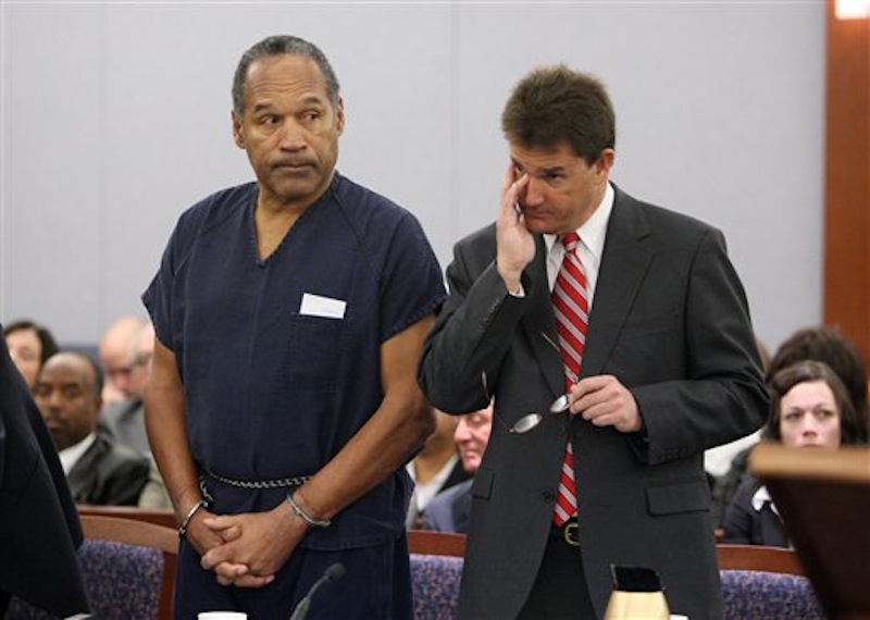 In this Dec. 5, 2008, file photo, O.J. Simpson, left, and his lawyer Yale Galanter appear during his sentencing hearing at the Clark County Regional Justice Center in Las Vegas. Simpson's new lawyer Patricia Palm is making another effort to gain the former football star's release from Nevada state prison, where he is serving nine to 33 years for kidnapping and armed robbery in a 2007 encounter with sports memorabilia dealers in Las Vegas. A 94-page document filed Tuesday, May 15, 2012 in Clark County District Court alleges Simpson was so badly represented by his trial and prior appellate lawyers that he deserves a new trial.(AP Photo/Isaac Brekken, Pool, File)