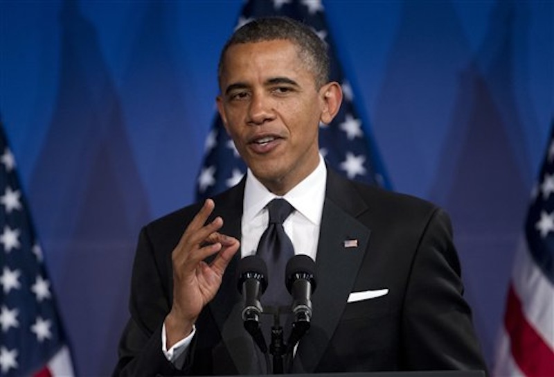 In this May 8, 2012 file photo, President Barack Obama speaks in Washington. Obama's popularity among women, minorities and independents is giving him an early edge over his likely GOP rival, Mitt Romney, according to a new AP-GfK poll. But Americans are split over which candidate can best handle the economy, which might open pathways for Romney. (AP Photo/Evan Vucci, File)