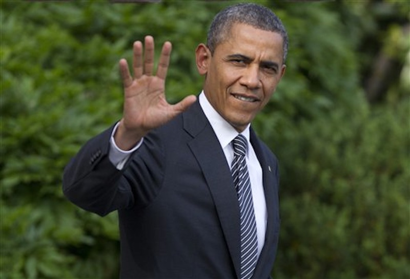 President Barack Obama waves as he walks from the White House in Washington, Friday, May 18, 2012, to board Marine One, as he travels to Camp David for the G8 Summit. Obama is calling on Congress to put into place new banking laws he signed in to law two years ago, instead of trying to weaken them. (AP Photo/Carolyn Kaster)