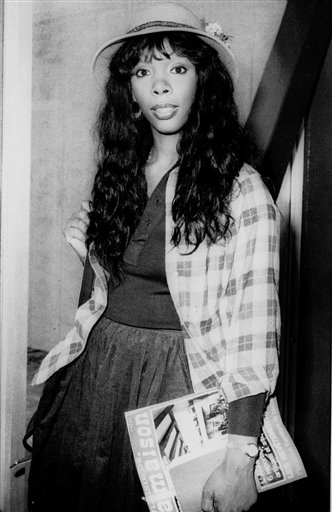 In this Oct. 21, 1977, photo, Donna Summer, 27, arrives at Heathrow Airport from Paris.