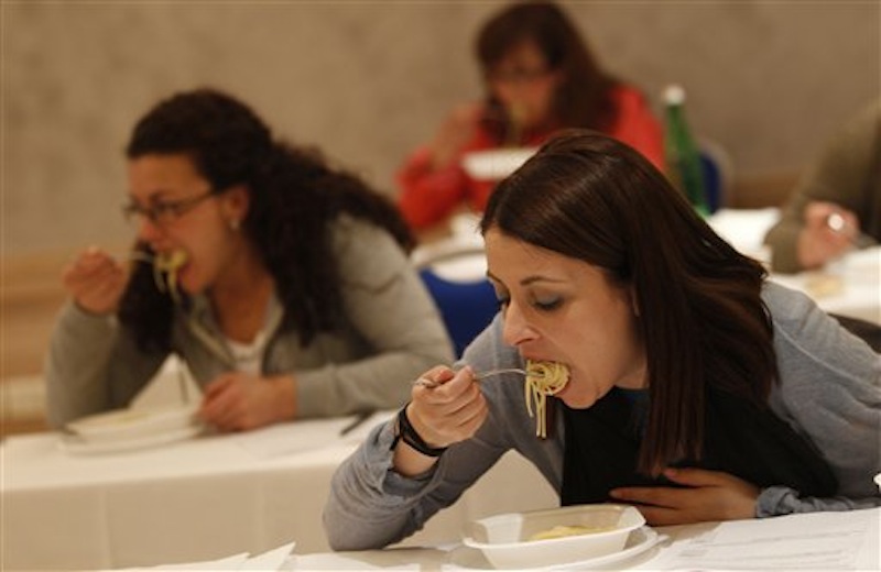 A group of women taste pasta in a hotel conference room in Rome, Friday, May 18, 2012. Pasta sales worldwide have grown steadily over the past three years. Pasta is serious business in Italy, and a recent blind taste test organized by the world's biggest pasta maker, Barilla, drove home that an awful lot of thought goes into making the simple combination of durum wheat semolina and water from which Italy's national dish is made. (AP Photo/Alessandra Tarantino)