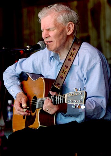 In this May 1, 2005, photo, master flatpicker Doc Watson plays during the "My Friend Merle" show during MerleFest in Wilkesboro, N.C.