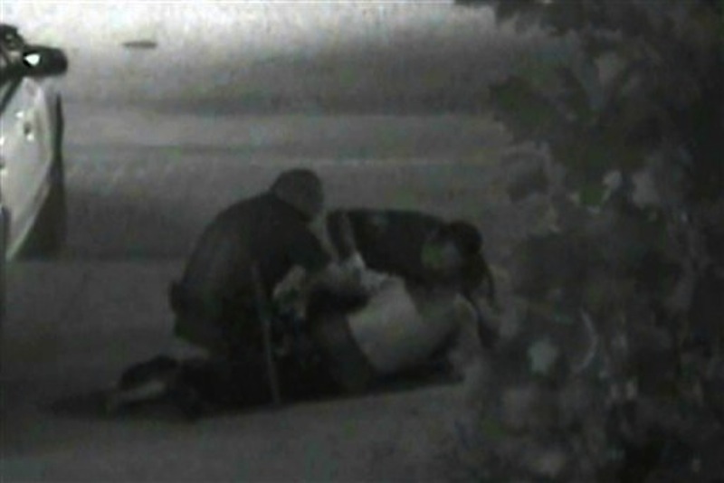 This still photo taken from a security camera released on Monday May 7, 2012 by the Orange County District Attorney shows an altercation between Fullerton police officers and homeless Kelly Thomas at the Fullerton bus depot on July 5,2011. The grainy black and white video of Thomas' violent encounter with police outside a bus depot is the centerpiece of the prosecutions' case against two officers accused of escalating a standard police encounter with a homeless man into a fatal beating. (AP Photo/Orange County District Attorney)