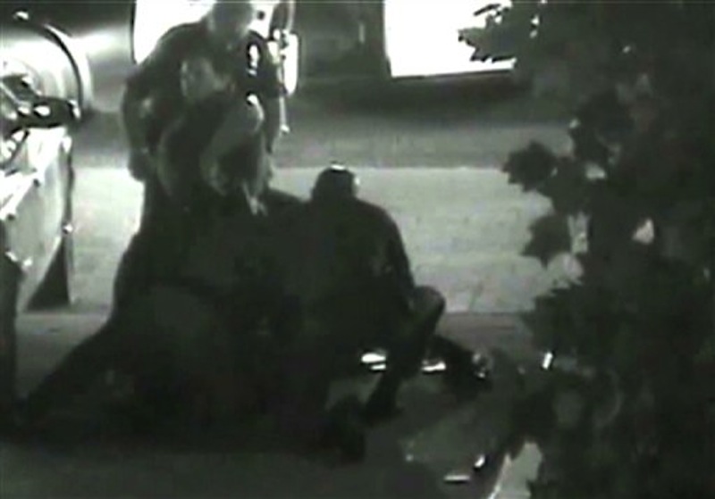 This still photo taken from a security camera released on Monday May 7, 2012 by the Orange County District Attorney shows an altercation between Fullerton police officers and homeless Kelly Thomas at the Fullerton bus depot on July 5,2011. The grainy black and white video of Thomas' violent encounter with police outside a bus depot is the centerpiece of the prosecutions' case against two officers accused of escalating a standard police encounter with a homeless man into a fatal beating. (AP Photo/Orange County District Attorney)