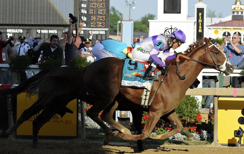 I'll Have Another (9), ridden by Mario Gutierrez, beats Bodemeister, ridden by Mike Smith, to the finish line to win the 137th Preakness Stakes horse race at Pimlico Race Course on Saturday.