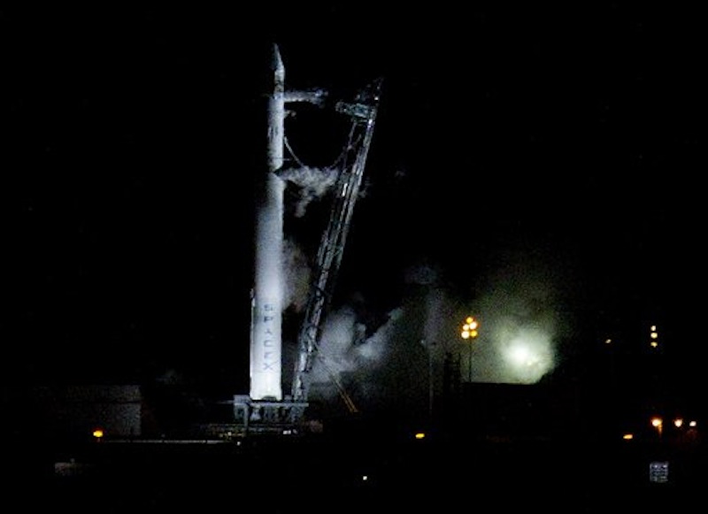 The Falcon 9 SpaceX rocket sits on the launch pad at complex 40 moments after the launch was aborted due to technical problems at the Cape Canaveral Air Force Station in Cape Canaveral, Fla., early Saturday, May 19, 2012.(AP Photo/John Raoux)