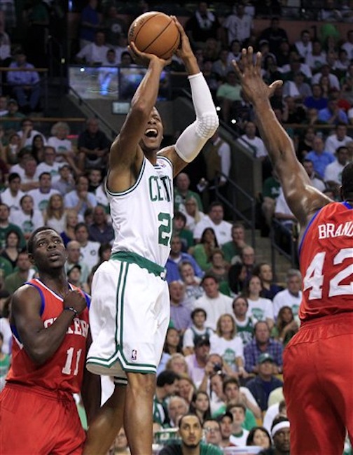 In this Saturday, May 26, 2012 photo, Boston Celtics guard Ray Allen (20) gets a jumper off against the defense of Philadelphia 76ers guard Jrue Holiday (11) and forward Elton Brand (42) during the first quarter of Game 7 in the NBA basketball Eastern Conference semifinal playoff series, in Boston. (AP Photo/Elise Amendola) Ray Allen, Elton Brand, Jrue Holiday