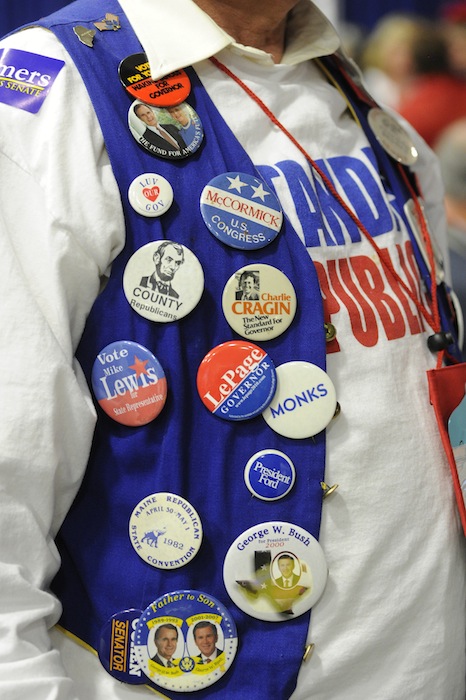 Kenn Brooks from Standish wears 52 years worth of campaign buttons at the GOP State Convention at the Augusta Civic Center on Saturday, May 5, 2012.