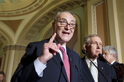 Sen. Charles Schumer, D-N.Y., speaks to reporters following a weekly strategy luncheon, Tuesday, May 8, 2012, on Capitol Hill in Washington. Schumer has asked airlines to let young children sit with their families for no extra charge. (AP Photo/J. Scott Applewhite)