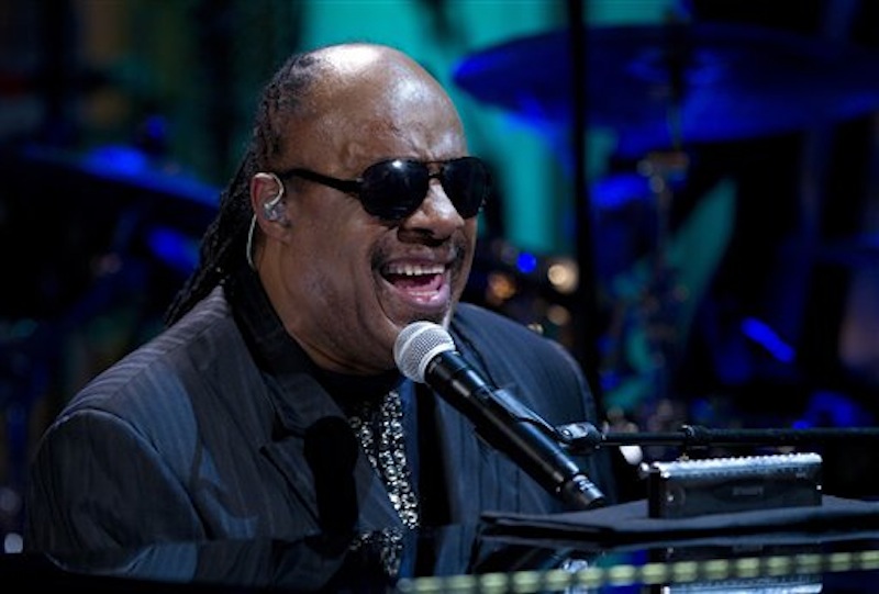 In this May 9, 2012 file photo, Stevie Wonder performs during the "In Performance at the White House" in the East Room of the White House in Washington, honoring songwriters Burt Bacharach and Hal David. Authorities have charged two people, including a man who identifies as Wonder's nephew, with extortion for a plot in which they tried to trade what they said was embarrassing information in exchange for money. (AP Photo/Carolyn Kaster, File)