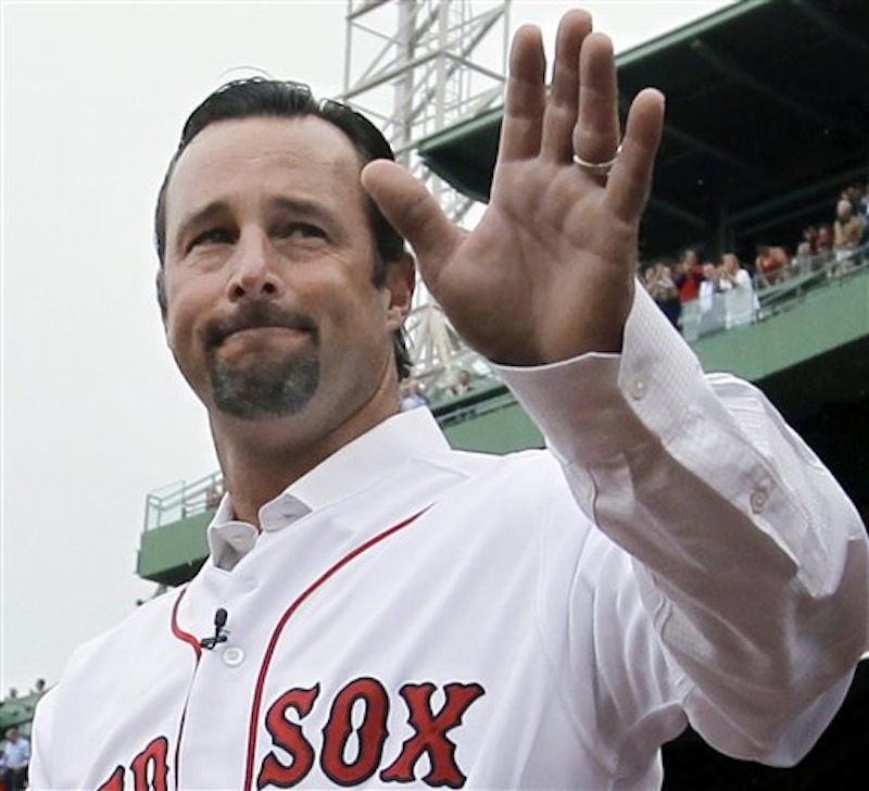 Retired Boston Red Sox pitcher Tim Wakefield waves to fans as he is introduced during a ceremony to honor his career, prior to the Red Sox's baseball game against the Seattle Mariners at Fenway Park in Boston, Tuesday, May 15, 2012. (AP Photo/Elise Amendola)
