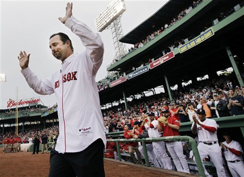 Newly retired Boston Red Sox pitcher Tim Wakefield reacts as he is introduced during a ceremony to honor his career prior to a baseball game against the Seattle Mariners at Fenway Park in Boston, Tuesday, May 15, 2012. (AP Photo/Elise Amendola)