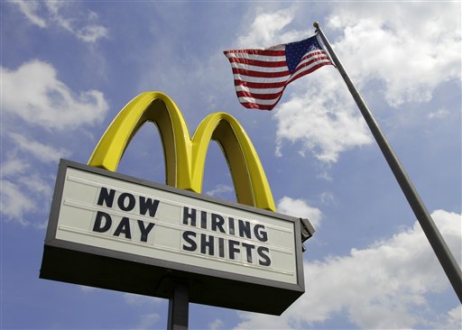 A McDonalds restaurant in Chesterland, Ohio, advertises job openings on Wednesday. The number of people seeking unemployment benefits fell last week by the most in more than three months, the Labor Department reported today.