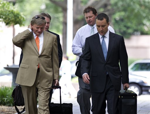 Former Major League Baseball pitcher Roger Clemens, back right, walks with his attorneys Rusty Hardin, front left, and Michael Attanasio, right, to the federal court in Washington, Wednesday, May 23, 2012. (AP Photo/Manuel Balce Ceneta)
