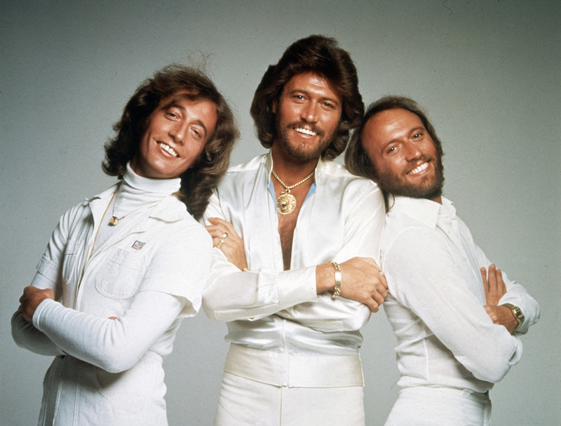 In this January 1979 file photo, the Bee Gees – from left, Robin, Barry and Maurice Gibb – pose for photographers, somewhere in England.