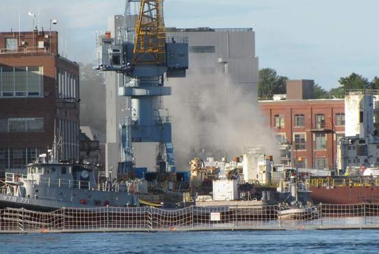 Smoke billows from the USS Miami, a nuclear submarine docked in Kittery, after a fire broke out in the sub's forward compartment last week.