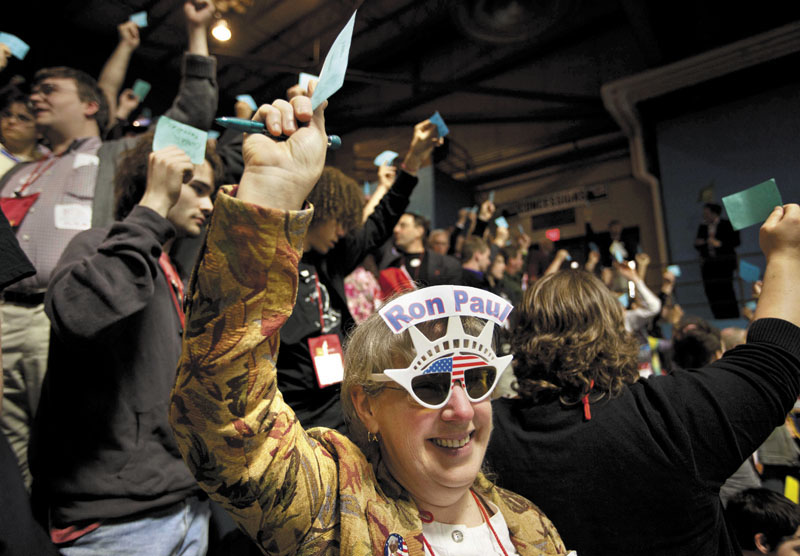 Linda Silvia of China, a delegate from Kennebec County, holds up a blue card Saturday while voting for Ron Morrell to be convention secretary during the Maine Republican Convention at the Augusta Civic Center. Ron Paul won the majority of delegates from Maine.
