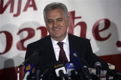 The nationalist Serbian Progressive Party leader, and presidential candidate, Tomislav Nikolic, talks to members of the media at a press conference in Belgrade, Serbia, Sunday, May 6, 2012. A pro European Union candidate and a nationalist opponent are headed for a runoff in Serbia's presidential elections, while the ruling pro Western party is likely to form the next coalition government, independent pollsters said Sunday. (AP Photo/ Marko Drobnjakovic)
