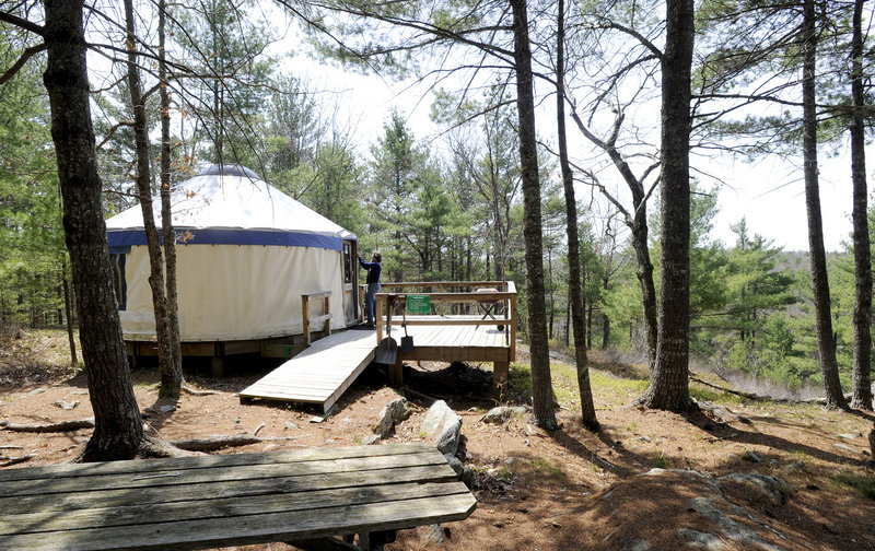 Tracy Moskovitz opens a yurt at the Hidden Valley Nature Center in Jefferson. Visitors can stay in the yurt, though the center suggests a donation of $70 for two people.
