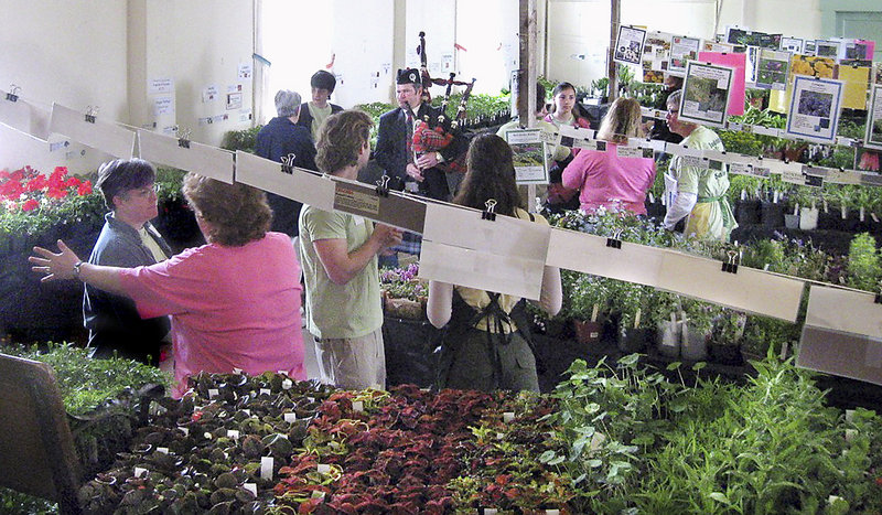 A bagpiper livens up the 2011 sale in the original Bowdoinham Town Hall.