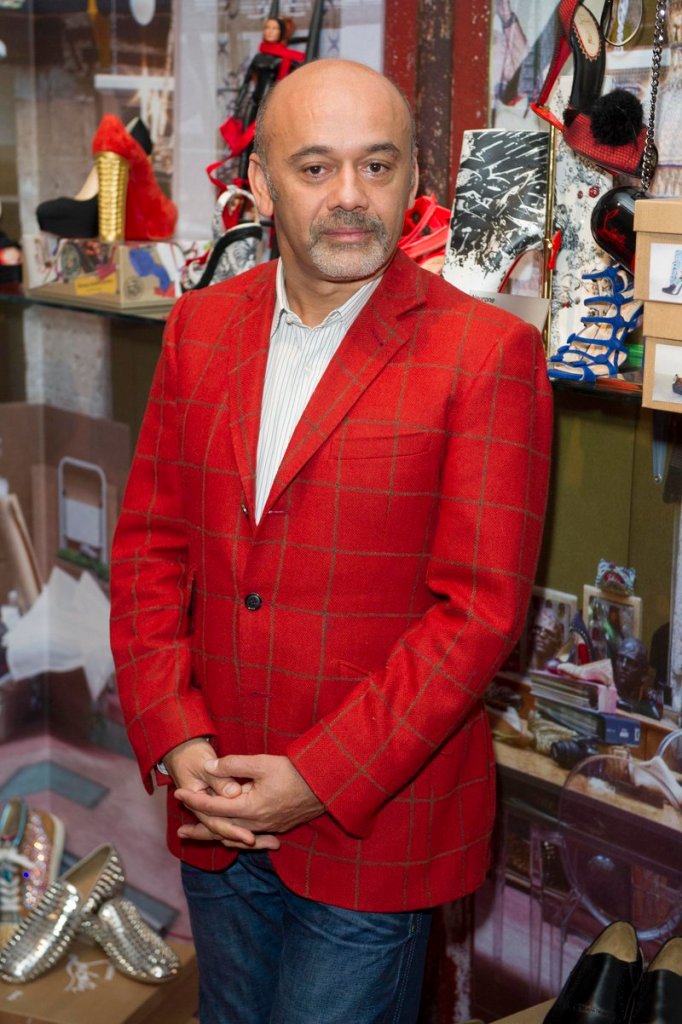 At the Design Museum in London on Monday, Christian Louboutin helps open an exhibition showcasing how he transformed the design of the shoe over the past 20 years.