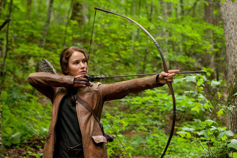 Jennifer Lawrence stars as Katniss Everdeen in “The Hunger Games,” the movie based on the dystopian trilogy of books. The series is engaging and well-written but too disturbing for children under 12, a reader says.