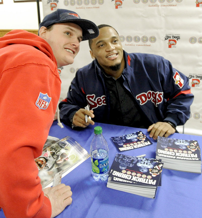 Jared Tarbox of Lyman poses with Patriots safety Patrick Chung Tuesday night at Hadlock Field. Chung signed autographs for almost an hour.