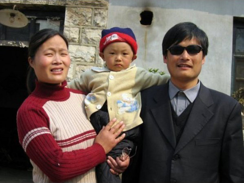 Blind Chinese legal activist Chen Guangchen, with his son, Chen Kerui, and his wife, Yuan Weijing, escaped house arrest into what activists say is U.S. diplomatic protection in Beijing.