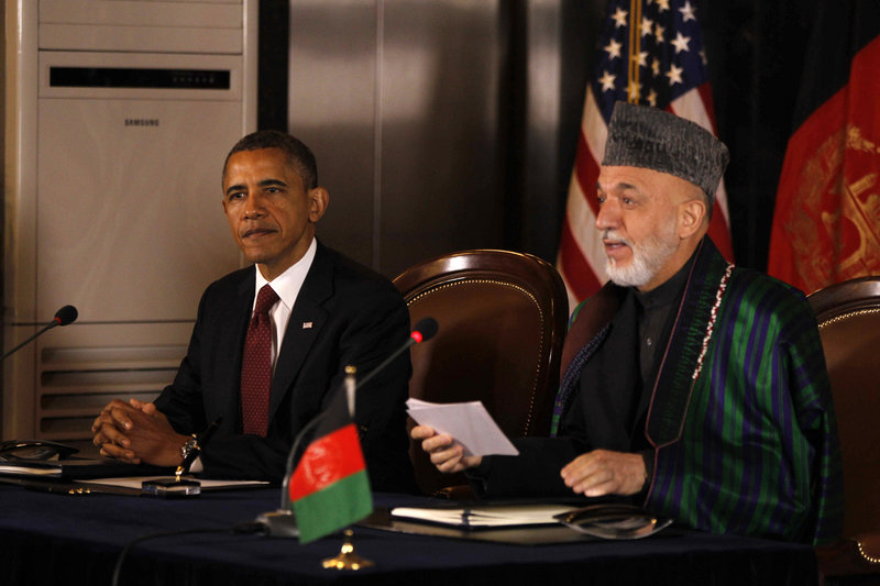 President Obama and Afghan President Hamid Karzai speak before signing a strategic partnership agreement at the presidential palace in Kabul, Afghanistan, on Wednesday.