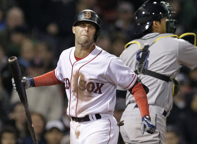 Dustin Pedroia shows his frustration after striking out in the sixth inning against Oakland on Wednesday night at Fenway Park. The Red Sox lost 4-2, dropping 2 of 3 to the Athletics.