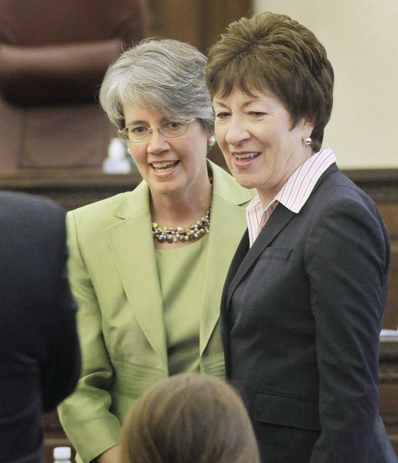 Nancy Torresen, left, introduces her relatives to Maine Sen. Susan Collins before Torresen was sworn in as a district judge at the federal courthouse in Portland. Political and judicial luminaries were well represented at the event.