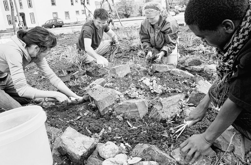 Gardeners prepare a bed for perennial herbs at the Boyd Street Community Garden in Portland in 2009. A city working group is identifying other parcels that could be community garden space, a reader says.