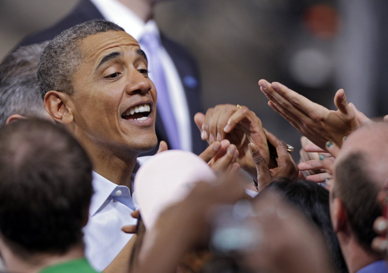 President Obama greets supporters after a campaign rally at Ohio State University in Columbus on Saturday. He portrayed Mitt Romney as a threat to the middle class and tried to soften the impact of what is likely to be the GOP’s best campaign issue: the economy.