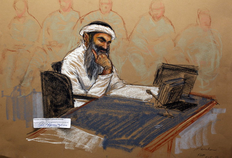 In courtroom artist’s sketch, Khalid Sheikh Mohammed, the self-proclaimed mastermind of the Sept. 11 attacks, reads a document during his military hearing at the Guantanamo Bay Naval Base in Cuba on Saturday.