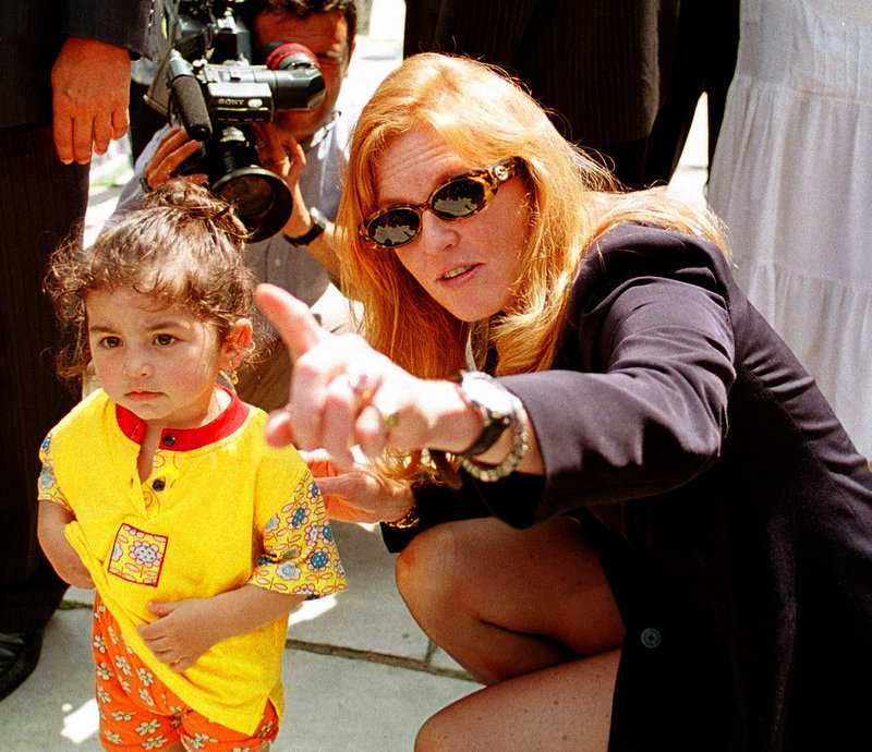 Sarah Ferguson kneels beside a Turkish child during a visit to Istanbul’s Blue Mosque in 1998. She could serve up to 22 1/2 years in prison if convicted of taking part in the secret filming of two orphanages in Turkey.