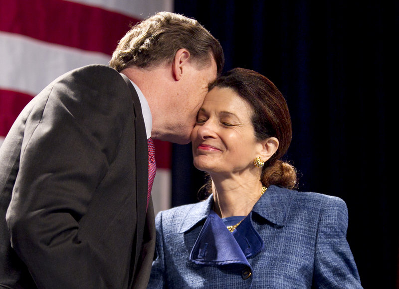 Sen. Olympia Snowe, R-Maine, gets a kiss from her husband, John R. McKernan, following her speech at the Maine Republican State Convention on Sunday.