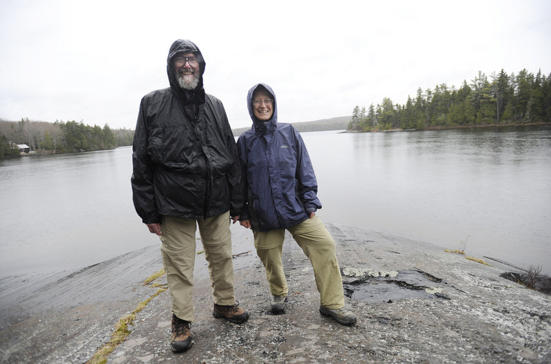 Stan and Michelle Moody, on the shore of Spectacle Pond off the Appalachian Trail in Monson, maintain a section of the trail and have a camp in nearby Elliotsville. They will help with the June 21 ceremony that will designate Monson as an official Appalachian Trail town.