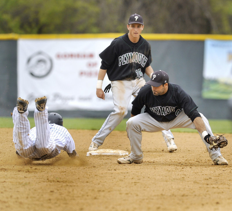 Ryan McIntosh of Plymouth State prepares to put the tag on Southern Maine's John Carey, who was caught trying to steal second base in the ninth inning Wednesday. Plymouth State won 3-2 in the first game of the Little East baseball tournament.