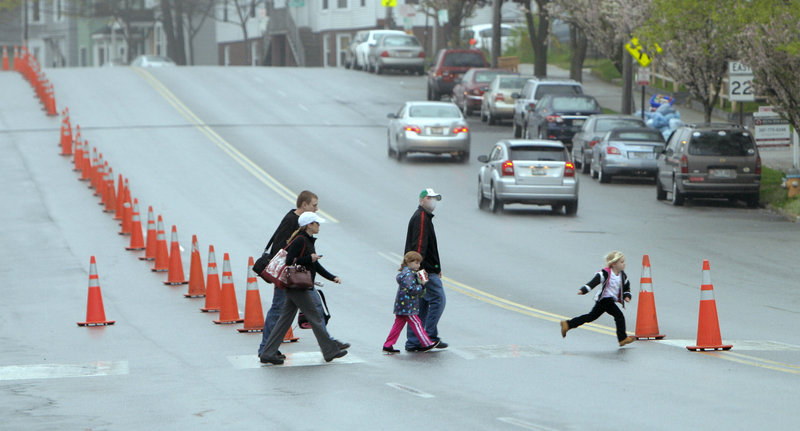 Pedestrians cross Park Avenue in Portland near Hadlock Field on Wednesday. Work on sections of Park Avenue and St. John Street is expected to begin after Labor Day.