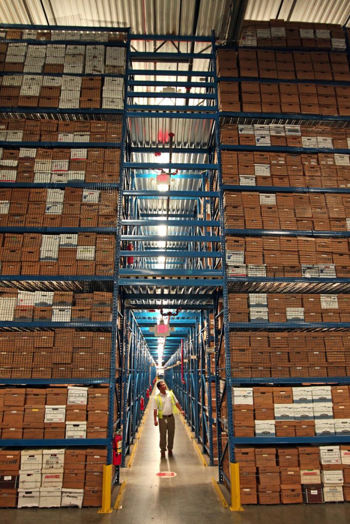 Armando Sanchez walks through the Recall facility in Medley, Florida,. Recall runs 300 document warehouses across the country.
