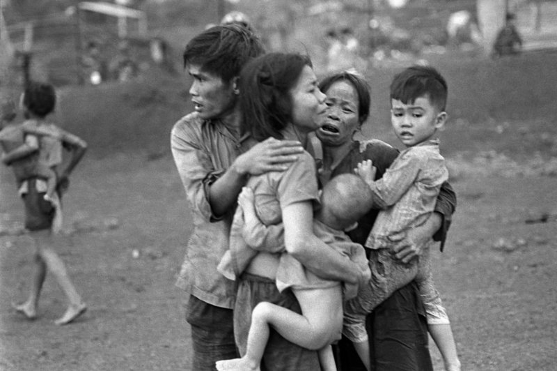 Associated Press photographer Horst Faas shot this picture in June 1965 of South Vietnamese civilians, among the few survivors of two days of heavy fighting, huddled together in the aftermath of an attack at Dong Xoai, Vietnam.